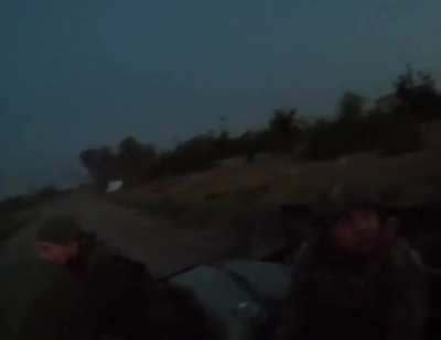 Russian soldier easily shoots down Ukrainian drone while driving.