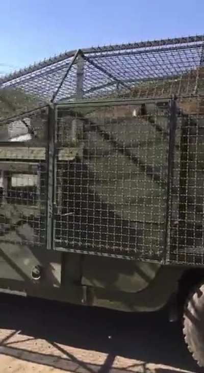 Ukrainian HMMWV with anti-drone screens installed around the whole vehicle