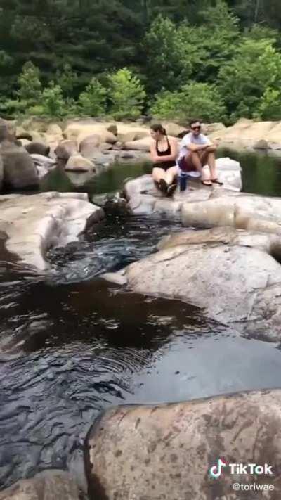 Guy goes headfirst into underwater cave