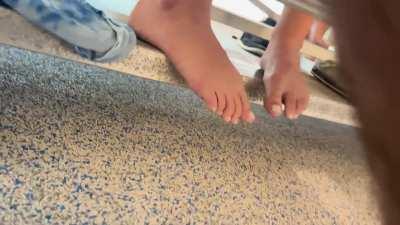 Candid feet at pool 