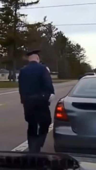 Police officers touch the rear of the car to leave fingerprints on it, so that it acts as a physical evidence of their presence in case they are attacked, or the person tries to flee.