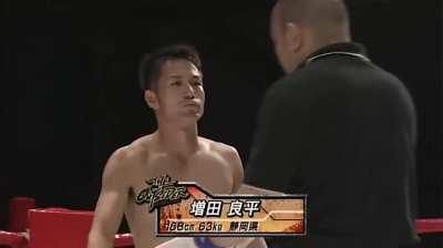 This is a Japanese martial arts match that resulted in a knockout within the first 2 seconds.