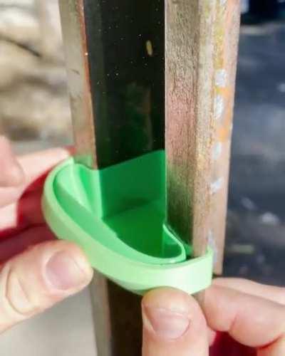 A bird feeder that fits in the metal extrusion of a stop sign (credit: u/tic-tor)