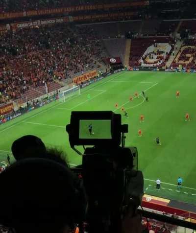 Camera operator following gameplay at professional soccer league match