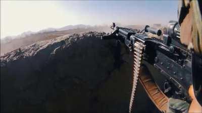 Taliban bullets whiz close overhead as M240B gunner provides suppressive fire (Kandahar, Afghanistan. No date)