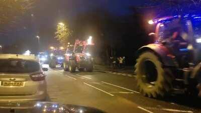 These tractors lit up on the road now, raising money for a local childrens hospital