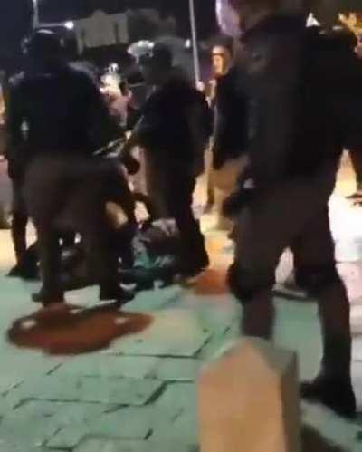 Israeli forces assaulting Palestinians, including girls, Haifa.