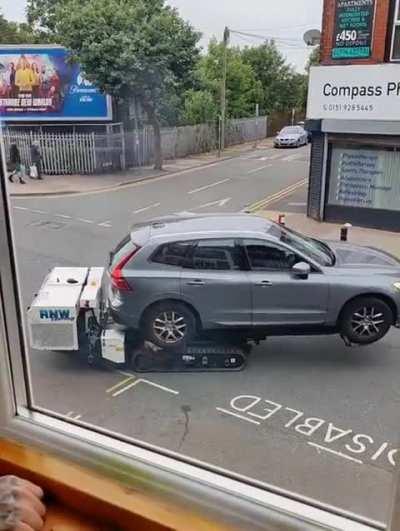 Donât overstay your welcome on the disabled parking spot in crosby beach,Liverpool or this robot will take your car