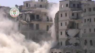 FSA &quot;Hell Cannon&quot; scores a lucky shot through an incredibly small widow, collapsing the building - Aleppo - 5/23/2015