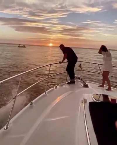 WCG throwing a ring on a boat