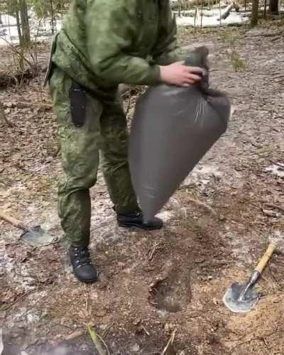 Using a plastic bag to stoke a dakota fire pit