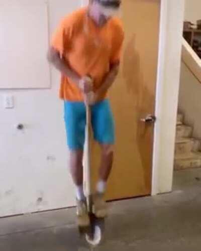 Man uses shovel as a pogo stick