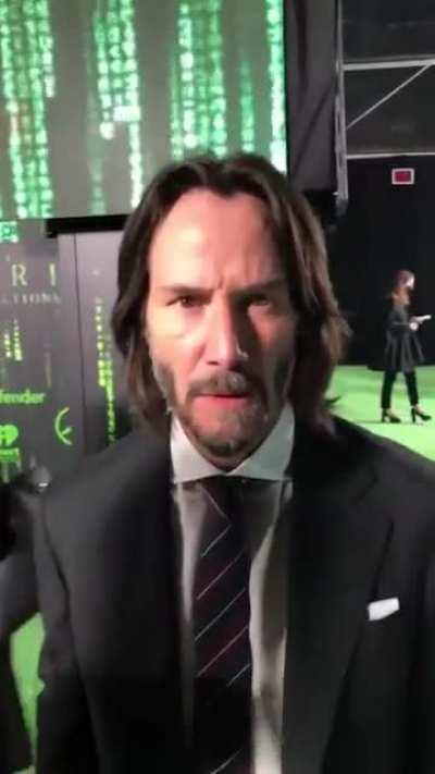 Keanu gets up close with a camera and bumps his head onto it