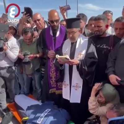 Priest praying for Palestinian Christian journalist killed by Israeli army