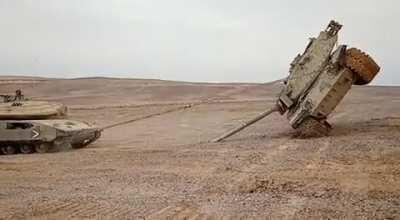 An M60 being used as practice on flipping a tank