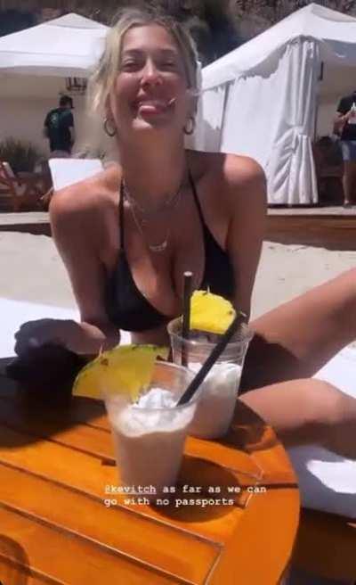 Black bikini barely hanging on