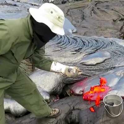 This is how geologists collect lava sample from an active volcano