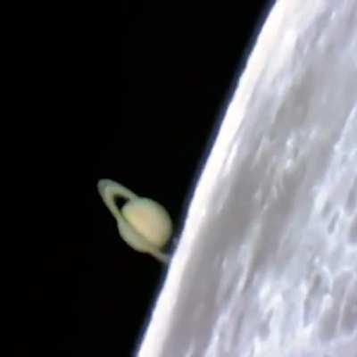 Saturn rising from behind the Moon