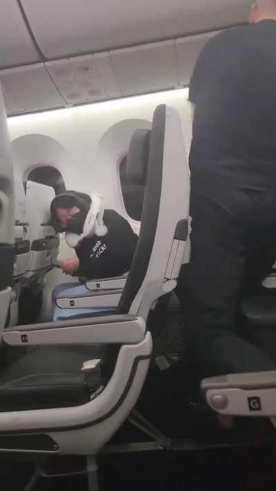 Two guys fighting over the a/c on a plane
