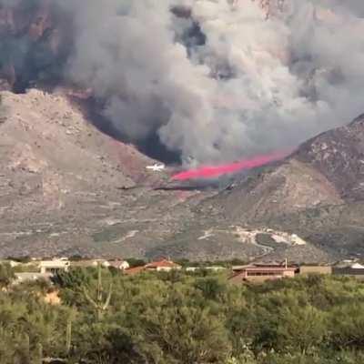 Airplane makes a close pass while fighting fires in Tucson, AZ