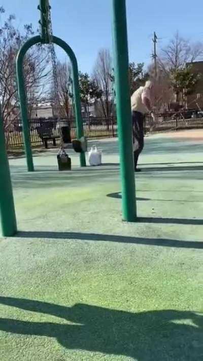 Old man Backflips off a swing and walks away like an OG.