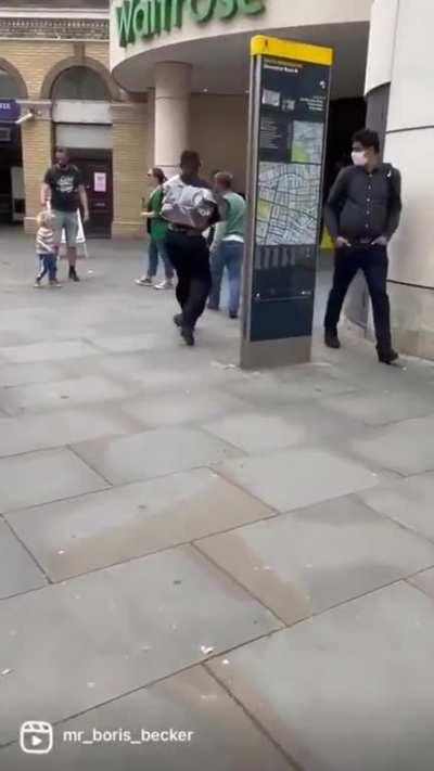 Man being followed by dancing tiktoker