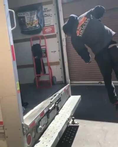 Guy backflips into the back of a truck