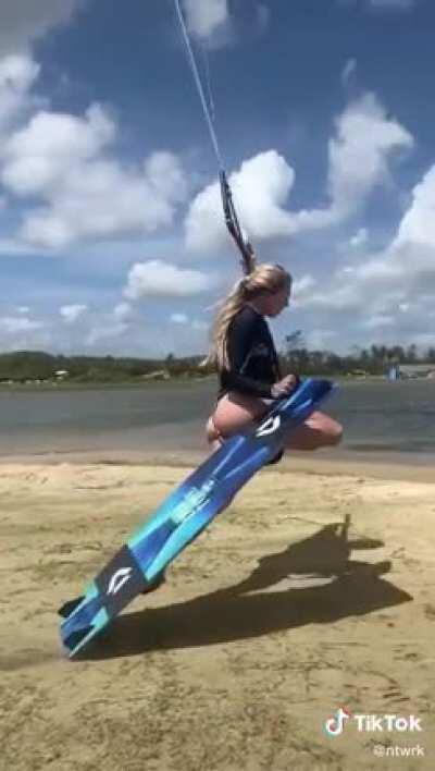 Parasail Wakeboarder Hannah Whiteley does a beach grind.