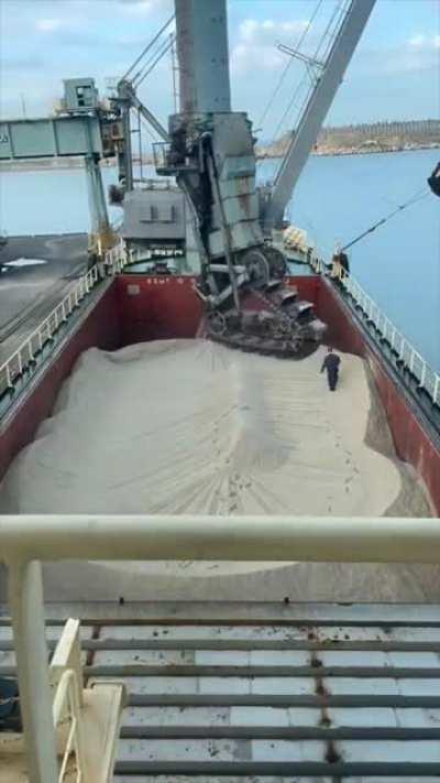 Mechanically removing sand from a ship