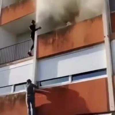 Old man rescued from a fire by some brave men!