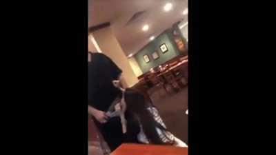 A waiter gets a blowjob inside of a restaurant