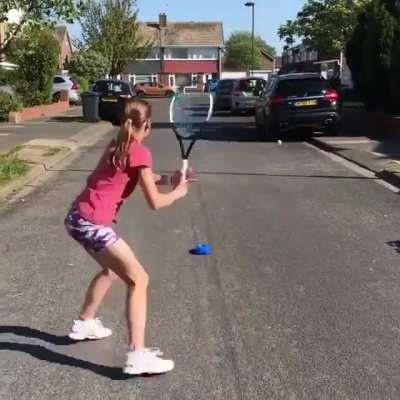 Attaching a tennis ball to the road in order to play solo