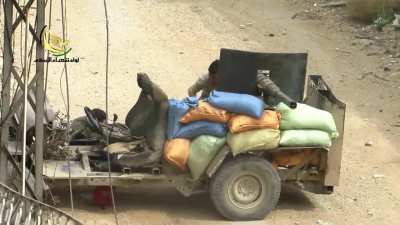 FSA fighters targeting Syrian Army positions with a cannibalized 2A28 &quot;Grom&quot; technical - Daraya - 6/4/2014