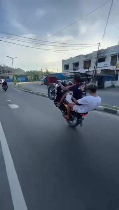 WCGW doing wheelie on a public road.