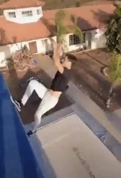 Jumping down from the roof to the trampoline