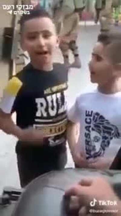 IDF Soldier entertaining some young Palestinians.