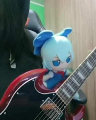 My fumo playing guitar