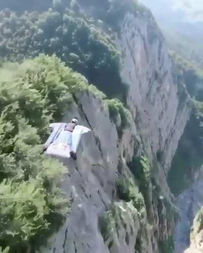 Gliding through the Swiss Alps in a wingsuit