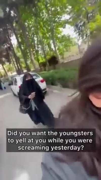 Brainwashed lady harass a girl returning from university in Iran 