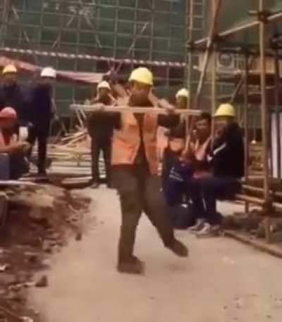 Chinese construction worker breakdancing