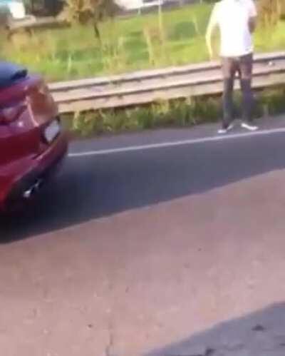 Binotto on the side of the road with his Alfa Romeo Stelvio (Unclear if he has been hit or he hit someone)