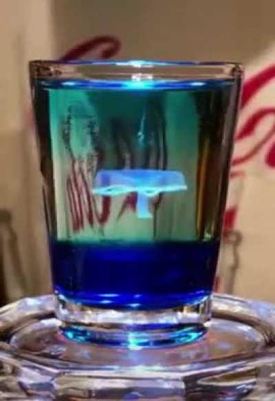 The Blue Jellyfish Shot, which  you can obtain by layering drinks with different densities and specific gravities