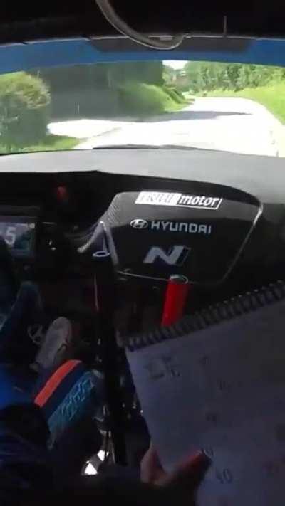 Rally car driver save from near head on collision