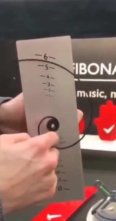 Fibonacci Spiral Clock where the line moves further from the centre by a factor of 1.618... (the Golden Ratio) for every 1/4 turn