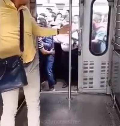 Slo-mo of Indians boarding a moving train