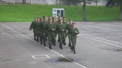 Soldiers marching to the national anthem