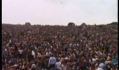 Dairy farmer Max Yasgur, the man who agreed to host the 1969 Woodstock music festival on his farm, is seen here giving a speech to over 400,000 attendees.