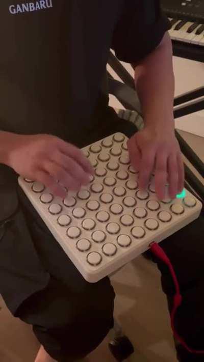 Guy playing a midi board