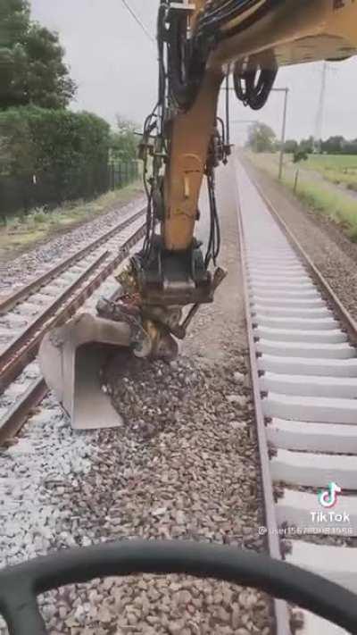 Moving rocks on a railroad track