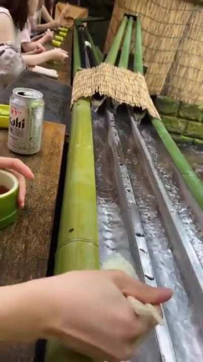 Nagashi somen is an eating style where you “catch” noodles with chopsticks as they make their way down a stream of flowing water